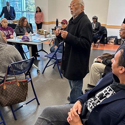 Judge Rohulamin Quander speaks to attendees at 1856 Project Community Convening