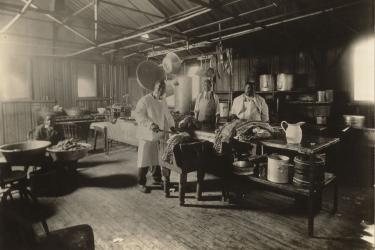 black and white photograph of Charlie Dory and kitchen staff, Maryland Agricultural College, c. 1912; (left to right: Bill Dory; Ferdinand Hughes; Spencer Dory; Charlie Dory)