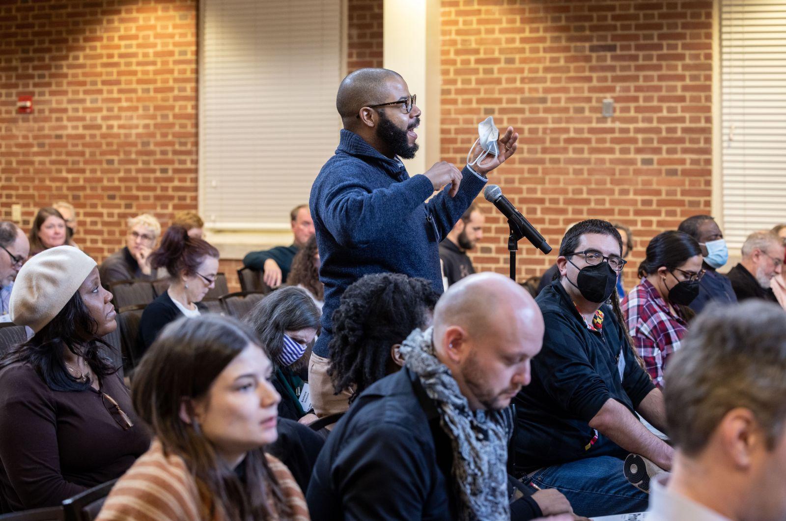 audience member Dr. Christopher Bonner asking a question of the Session 2 panelists